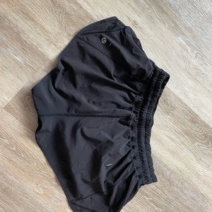Black Lulu lemon hotty hot shorts. Size womens 6 abs are 2.5 in long.